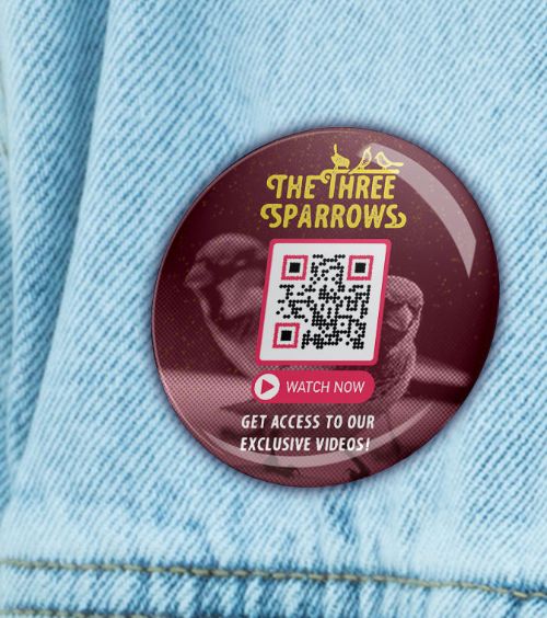 A button badge from a band’s merchandise collection with a QR Code that displays exclusive video footages.
