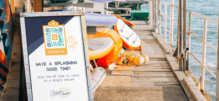 : A QR Code advertisement on a dock for a kayaking tour company asking for customers to leave a Google review.